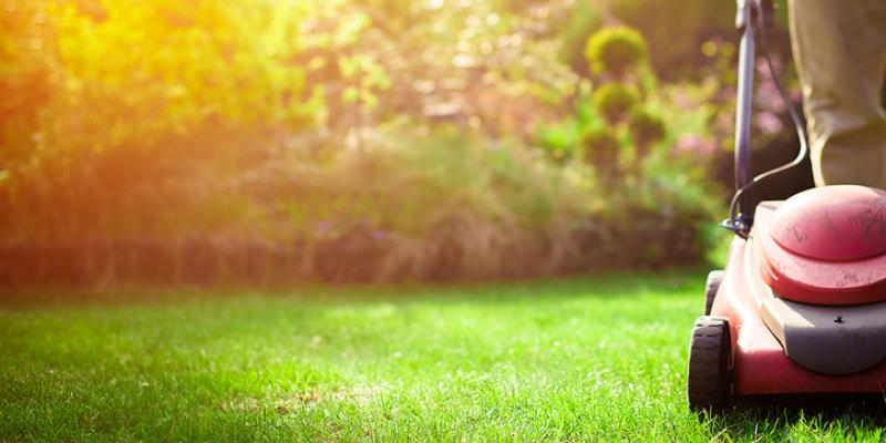 A man mowing a nice lawn